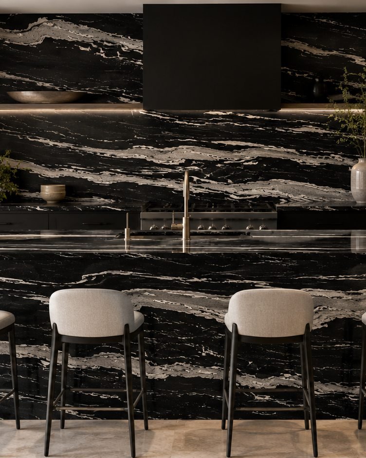 Kitchen feature wall and bar seating in Copacabana Granite, a Stone Experience project